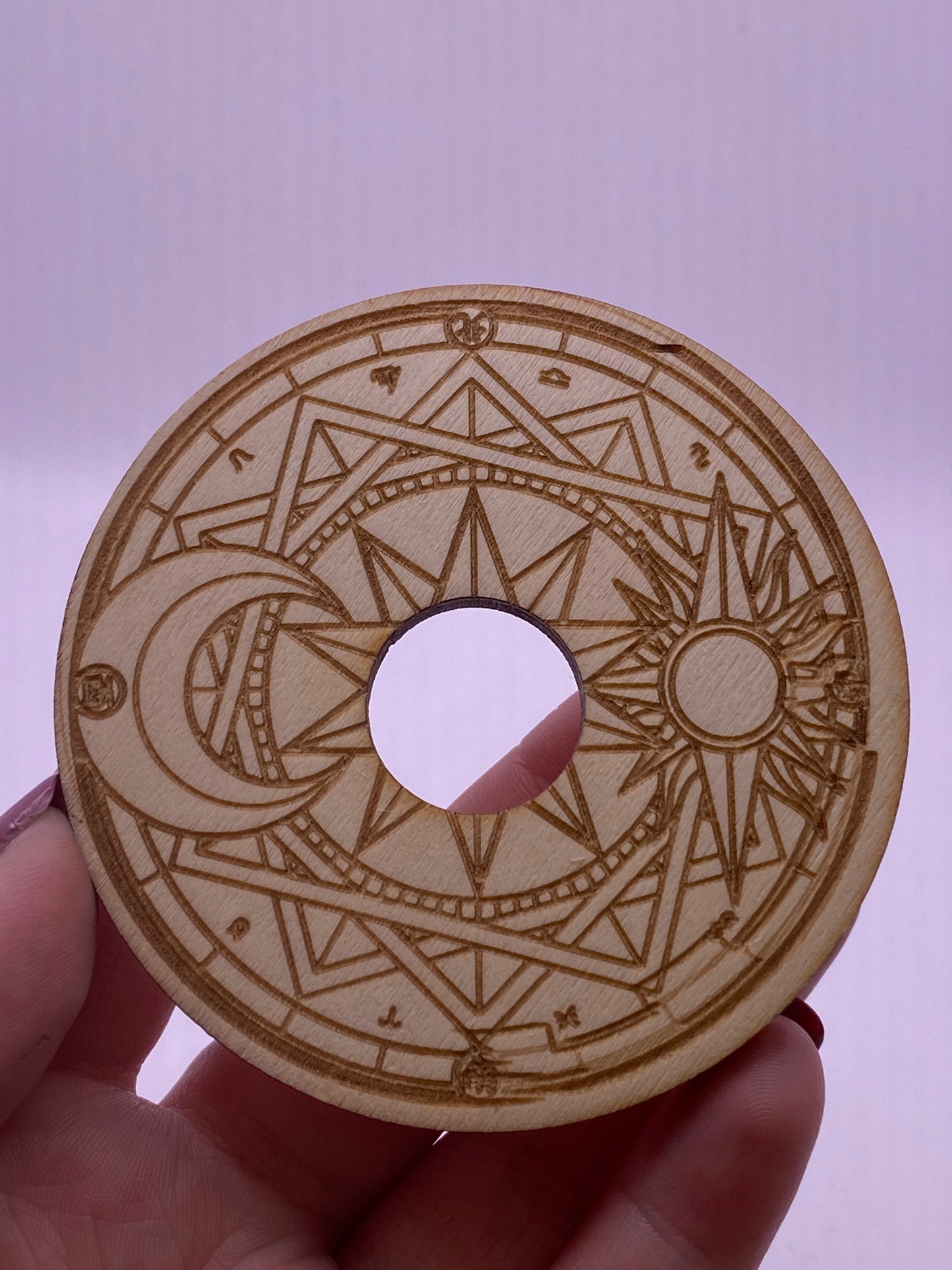 Wooden sun and moon sphere holder