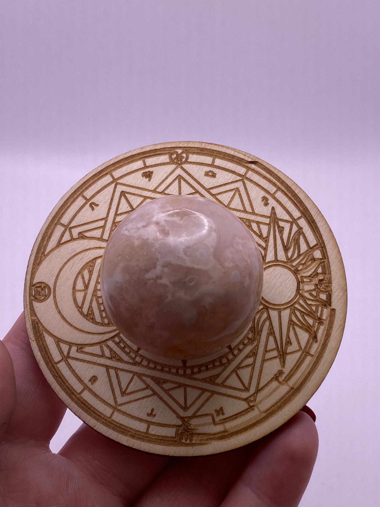 Wooden sun and moon sphere holder