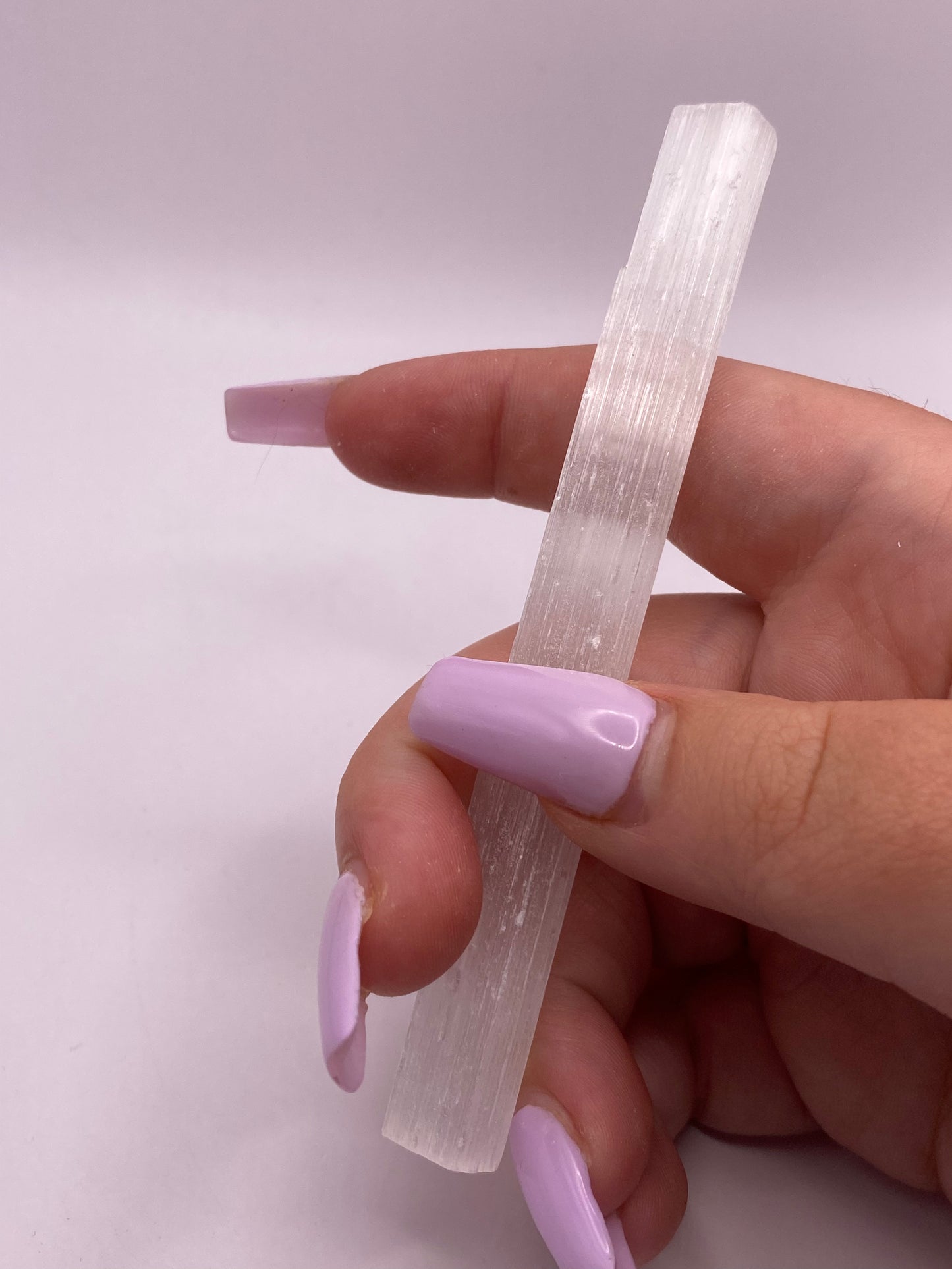 Slim satin spar selenite stick.