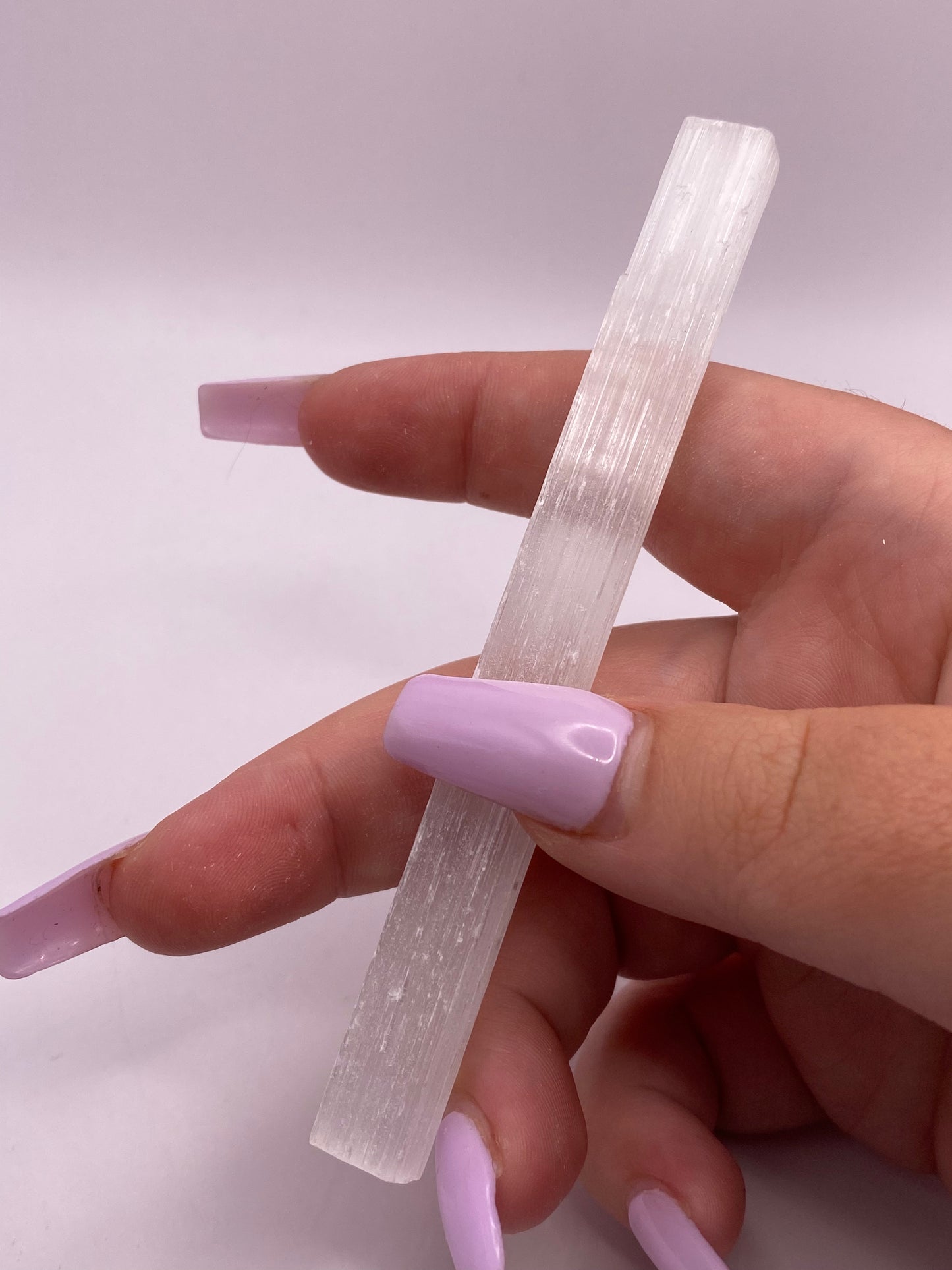 Slim satin spar selenite stick.