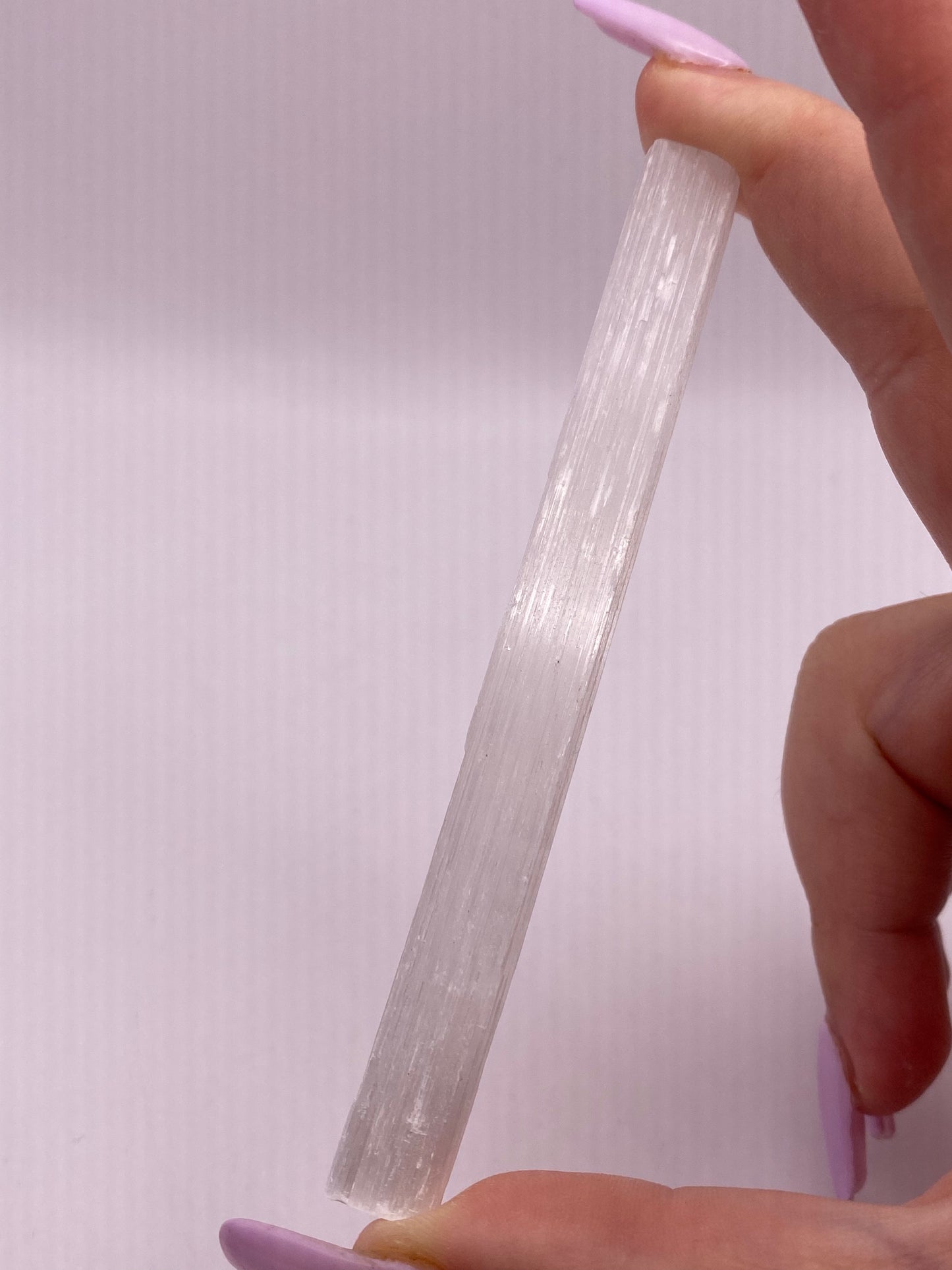 Slim satin spar selenite stick.